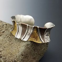 This stunning cuff bracelet was made from sterling, brass, copper and reticulated silver. It is an absolute eye catcher and one of the most beautiful pieces I have ever made.   You will never find another like this one, and It is comfortable to wear for dressy or casual occasions. The bracelet was formed on an anticlastic / synclastic stake (a curved steel stake) and is domed inward.  The interior circumference measures 6 1/8 inches at its narrowest / center circumference line with a 7/8 inch ga Sterling Silver Heart Bracelet, Metal Cuff Bracelet, Brass Cuff, Lace Earrings, Heart Dangle Earrings, Mixed Metals, Artistic Jewelry, Sterling Silver Heart, Heart Bracelet