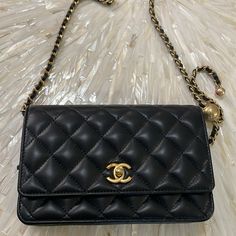 Chanel Black Leather Chain Wallet With Gold Clasp And Gold/Black Chain. Never Worn. Excellent Condition. Black Crossbody Bag Chanel, Elegant Black Flap Bag With Cc Turnlock Closure, Luxury Everyday Black Shoulder Bag With Cc Turnlock, Luxury Wallets With Detachable Strap Crossbody, Luxury Black Clutch Flap Bag, Black Luxury Clutch Flap Bag, Designer Flap Bag With Chain Strap For Everyday Luxury, Designer Clutch Wallet On Chain With Detachable Strap, Luxury Black Wallet On Chain With Detachable Strap