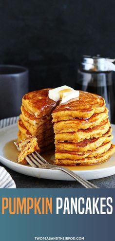 fluffy pumpkin pancakes on a plate with butter and syrup