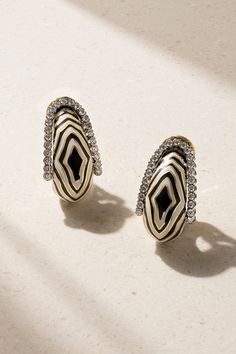 DAVID WEBB's earrings were created for Diana Vreeland, who was photographed wearing them in the '60s - the American fashion editor and columnist owned a vast collection of the label's zebra-inspired designs. Handmade from 18-karat gold and platinum, they have enameled stripes and are set with rows of sparkling brilliant-cut diamonds. Luxury White Hoop Earrings For Evening, Funky Shirts, Diana Vreeland, David Webb, American Fashion, Fine Jewellery Earrings, Clip Earrings, Fashion Editor, Gold Platinum