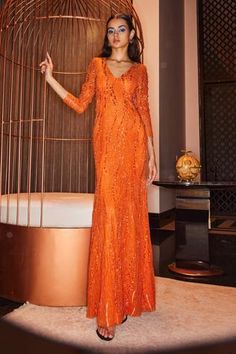 Shop for House of Eda Orange Polyester Milla Embellished Gown for Women Online at Aza Fashions Long Sequined Gown For Festive Occasions, Festive Long Dress Gown With Sequins, Fitted Sequin Gown For Festive Occasions, Fitted Sequin Festive Gown, Festive Fitted Sequin Gown, Festive Long Sequin Gown, Fitted Hand Embellished Evening Dress For Festive Occasions, Sequin Dress For Party Season Reception, Sequin Dress For Reception And Party Season