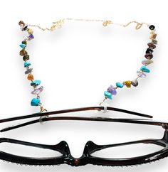 28” long chain with rubber eye glass gaskets to put on the ends of eyeglasses or sunglasses to hold your glasses onto your neck like a necklace. Comes with lobster clasp to transform into a necklace if wanted. Brass, resin and gemstone styles. Designed for convenience and style, this eyeglass holder necklace keeps your glasses close by while adding a chic touch to any outfit. The durable chain ensures secure attachment and the sleek design complements any aesthetic. Keep your glasses easily acce Eyeglass Holder Necklace, Eyeglasses Holder Necklace, Eyeglass Necklace, Secure Attachment, Star And Moon, Sunglass Holder, Eye Glass, Eyeglass Holder, Resin Flowers