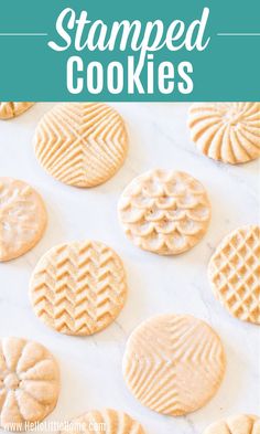 some cookies that are sitting on a white surface with the words, how to make stamped cookies