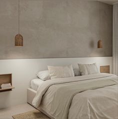 a bed with white sheets and pillows in a bedroom next to a wall mounted shelf