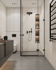 a bathroom with a walk in shower next to a sink