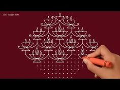 a hand drawing a pattern on a red background