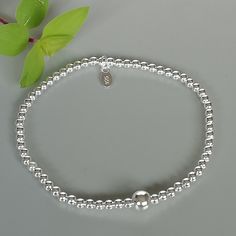 This is a sterling silver bracelet made with small beads. Diameter: 7.5 inches Beads: 2mm Big Bead: 5mm This bracelet is made of 925 hypoallergenic sterling silver. This piece is sent in a gift box. I can include a personal message from you if needed You are welcome to contact me at... bhavnakwintra1956@gmail.com For more beautiful pieces from my shop, please browse 👇 TOE RINGS: https://www.etsy.com/your/shops/TheSilverGame/tools/listings/section:27020628,view:table EAR HOOPS: https://www.etsy. Sterling Silver Bracelets With Silver Beads, Minimalist Sterling Silver Bracelet With Silver Beads As Gift, Silver Sterling Bracelets With Round Beads, Everyday Silver Charm Bracelet With Silver Beads, Dainty Silver Charm Bracelet With Round Beads, Everyday Sterling Silver Bracelet With Silver Beads, Sterling Silver Beads Charm Bracelet, Silver Sterling Silver Beaded Bracelets, Sterling Silver Bead Bracelet