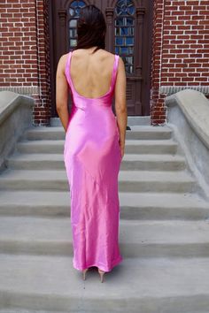 This maxi dress features a scoop neckline, sleeveless, open back, hidden side zipper closure, asymmetrical thread detail, satin material, and maxi length. 100% Polyester Hand Wash Cold. Do Not Bleach. Hang Dry. Iron Low. Madison is 5’8“ wearing a size Small.Model measurements:Bust: 32 in.Waist: 24 in.Hip: 34 In. Satin Maxi Dress With Ruched Back, Summer Maxi Dress With Cowl Back For Night Out, Fitted Bias Cut Satin Maxi Dress, Satin Maxi Dress With Back Opening For Night Out, Spring Maxi Dress With Ruched Back For Night Out, Satin Floor-length Maxi Dress With Ruched Back, Spring Satin Midi Dress With Cowl Back, Satin Maxi Dress With Bias Cut For Date Night, Sleeveless Satin Dress With Side Slits