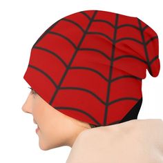 a woman wearing a red spider - man hat with black lines on the front and sides