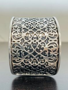 This intricate patterned cuff bracelet is made is sterling silver and is 1 5/8 inches wide.  It is substantial; 60.2 grams!  This bracelet has an arrowhead hallmark and is stamped 925.  This cuff was made in India and is in excellent condition.  SO PRETTY! Elegant Stamped Silver Cuff Bracelet, Elegant Wide Band Stamped Jewelry, Formal Silver Etched Cuff Bracelet, Formal Etched Silver Cuff Bracelet, Elegant Antique Silver Cuff Bracelet With Oxidized Finish, Feminine Wardrobe, Glendale Az, Pearl And Diamond Ring, Filigree Ring