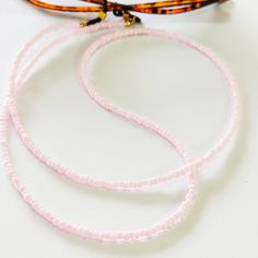 Pink beaded glasses chain, Sunglasses pink cord, Eyewear holder, Sunglasses necklace, Pink glasses holder, Sunglasses strap, Eyeglasses cord Beautiful fashion trend sunglasses beaded string This sunglass strap is lightweight, comfortable to wear and secures your sunglasses on your neck. Fashion trend accessory for the summer! Total length is 70cm / 27.7 inches. Beautifully packaged and ready for gift giving. JEWELRY CARE: Please take care of your jewelry do not wear in the shower, swimming pool, Pink Glass Beaded Necklaces For Gift, Pink Glass Beaded Necklace For Gift, Adjustable Pink Necklaces For Fashion Accessory, Trendy Adjustable Pink Beaded Necklaces, Trendy Pink Adjustable Beaded Necklaces, Trendy Pink Adjustable Beaded Necklace, Elegant Pink Glasses Chain As Gift, Elegant Pink Glasses Chain Gift, Trendy Pink Glass Jewelry