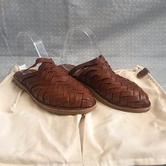 New Without Tags. Includes Dust Bag. Brown Leather Flat Heel Sandals, Woven Leather Slip-on Mules, Brown Woven Leather Closed Toe Mules, Brown Closed Toe Woven Leather Mules, Closed Toe Leather Woven Mules, Closed Toe Leather Mules With Woven Design, Brown Faux Leather Flat Sandals, Brown Flat Faux Leather Sandals, Brown Woven Leather Flat Sandals