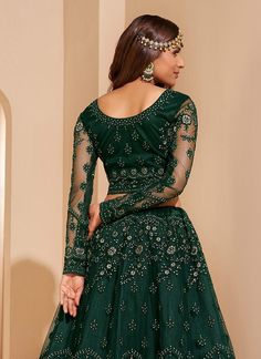 Dark Green Zari Embroidered Wedding Lehenga Choli Shop Eid Outfits & Dress. Free International Shipping. best pick as an indian wear for festivals or wedding event. This elegant set has a very pretty thread embroidery detailed with zari and pearl work on canned net lehenga with satin lining paired with equally embellished matching net and satin choli and ethnic motifs embroidered net dupatta. Team this beautiful attire with classic pair of heels and golden jewellery to look like a diva. This set Diwali Embroidered Semi-stitched Lehenga, Floor-length Embroidered Choli For Diwali, Semi-stitched Art Silk Choli For Eid, Eid Semi-stitched Embroidered Choli, Diwali Semi-stitched Choli With Intricate Embroidery, Embroidered Semi-stitched Choli For Eid, Eid Semi-stitched Art Silk Choli, Festive Choli With Intricate Embroidery, Eid Embroidered Semi-stitched Choli