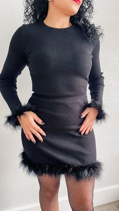 Details: Dress features round neckline, long sleeve, feather cuff and hem, rib knit and mini length. 52% Viscose, 29% Polyester, 19% Nylon Hand wash cold Color: Black True to size fit Model is wearing a size medium Measurements:Measurements are approximate Small: Bust 32-34” | Waist 25-26” | Hips 38-39"Medium: Bust 35-36" | Waist 27-28” | Hips 40-41"Large: Bust 38-40" | Waist 29-30”| Hips 42-44" Chic Crew Neck Mini Dress For Party, Chic Mini Dress With Crew Neck For Party, Fall Party Dress With Crew Neck, Long Sleeve Sweater Dress For Winter Party, Feathered Mini Dress For Fall, Fall Mini Dress With Feather Trim, Fall Feathered Mini Dress, Long Sleeve Mini Dress With Feathers For Spring, Long Sleeve Winter Dress With Ribbed Cuffs