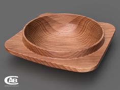 an empty wooden bowl on a gray background