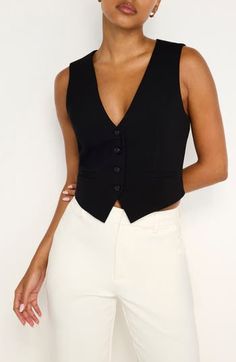 Update your workday wardrobe in this polished vest designed in a relaxed fit and versatile hue. Front button closure V-neck Front welt pockets Lined 66% polyester, 28% viscose, 6% elastane Machine wash, line dry Imported Black Owned/Founded Black Vest Outfits, Black Vest Outfits For Women, Black Vest Outfit, Hatter Costume, Vest Outfits For Women, Dresses Art, Mad Hatter Costume, Vest Outfit, Vest Designs