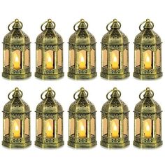 eight brass lanterns with candles in them