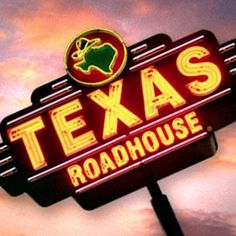 a neon sign that says texas roadhouse