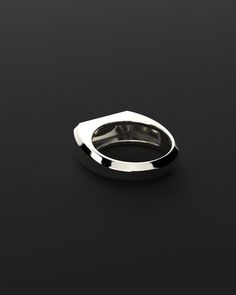 Example of minimalist design with slim lines and shiny surfaces handcrafted in sterling silver by our experienced artisans. This ring is proof that with a simple design you can also acquire character and forcefulness.It is perfect to wear on any occasion and does not go out of style. Made entirely by hand with all the love and art of the best silver artisans. Available in 3 finishes: silver, gold and black gold. Metal: 925 Solid Sterling Silver / 24k Gold Plated / Rhodium over 925 Sterling Silver Dimensions: 7 mm W x 25 mm L Weight: 8.6 grams Seekers Logo on Front 100% Handcrafted Package: High quality velvet pouches Timeless White Gold Sterling Silver Dome Ring, Timeless White Gold Dome Ring In Sterling Silver, Modernist White Gold Signet Ring For Formal Occasions, Modern Polished Finish Rings For Anniversary, Modern Platinum Rings For Gift, Minimalist White Gold Rings For Formal Events, Modern Platinum Rings For Gifts, Minimalist White Gold Rings For Formal Occasions, Modern Promise Ring With Round Band