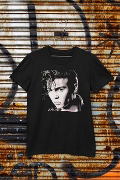 Cry-Baby Johnny Depp Unisex Tee Shirt for Johnny Depp fans. This classic unisex jersey short sleeve tee fits like a well-loved favorite. Soft cotton and quality print make users fall in love with it over and over again. These t-shirts have-ribbed knit collars to bolster shaping. The shoulders have taping for better fit over time. Dual side seams hold the garment's shape for longer. \n.: 100% Airlume combed and ringspun cotton (fiber content may vary for different colors)\n.: Light fabric (4.2 oz Unisex Cotton T-shirt For Fan Merchandise, Unisex Crew Neck T-shirt For Fan Merchandise, Fan Merchandise Short Sleeve T-shirt, Unisex Short Sleeve Fan Merchandise T-shirt, Unisex Graphic Print Shirt For Fan Merchandise, Pop Culture Short Sleeve T-shirt With Front Print, Unisex Graphic Tee For Fan Merchandise, Pop Culture Front Print Short Sleeve T-shirt, Graphic Tee T-shirt For Fan Merchandise