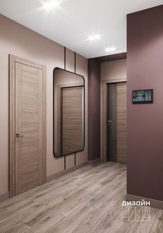 an empty room with wooden doors and mirrors on the wall, in front of a pink wall