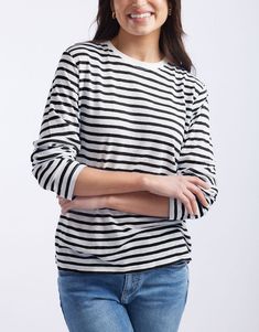 DESCRIPTION Embrace casual comfort with the Long Weekend Top in White/Black Stripe by White & Co. This top is designed for comfort and style, featuring a relaxed fit, crew neckline, and long sleeves. The crisp white base with black stripes brings a classic look perfect for casual days. This top ensures all-day comfort, making it an ideal choice for weekend wear or a relaxed day out. Team the Long Weekend Top with rolled-up jeans and white sneakers for a casual yet chic look. This versatile top s Black Long Sleeve Crew Neck Top For Spring, Classic Crew Neck Long Sleeve Top For Spring, Casual Crew Neck Long Sleeve Top For Work, Black Relaxed Fit Long Sleeve Casual Top, Black Casual Long Sleeve Top With Relaxed Fit, Spring Black Long Sleeve Top With Relaxed Fit, Black Relaxed Fit Long Sleeve Top For Spring, White Cotton T-shirt With Striped Sleeves, White Vertical Stripes Crew Neck T-shirt