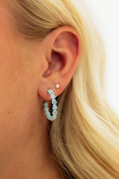 Elevate your style with these stunning Floral Hoop Earrings in light blue! These hoop earrings feature delicate floral details that add a touch of elegance to any outfit. The perfect accessory to enhance your natural beauty and make a statement! Sparkle and shine with these must-have earrings. Floral Hoop Earrings-Light Blue, boutique clothing, casual, the perfect earrings! Boutique Clothing Blue Hoop Earrings For Spring, Blue Hoop Earrings For Wedding, Elegant Blue Hoop Earrings For Summer, Blue Boutique, Floral Azul, Floral Hoops, Clothing Casual, Sparkle And Shine, Bring Happiness