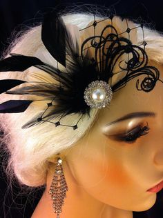 "Vintage Style Bridal Hair Fascinator, Wedding Fascinator, Fascinator, Ostrich Fascinator, Bridal Fascinator, Wedding Accessories, Bridal Accessories, Rhinestone Bridal Ivory Fascinator, Bridal Fascinator, Fascinator, Bridal Wedding Fascinator~ Visit the shop here https://www.etsy.com/shop/IceGreenEyes THE GOOSE FEATHERS ALSO COME IN (BACKGROUND COLOR OF FASCINATOR) GREY HOT-PINK TEAL WHITE CHAMPAGNE BLACK IVORY BROWN ~Champagne Goose Feathers~ ~Black Iridescent Coque Feathers~ ~Black Hackle~ ~B Black Gatsby Style Wedding Headpiece, Feathered Mini Hat Headband For Weddings, Black Feathered Wedding Costume Hat, Black Feathered Costume Hat For Wedding, Elegant Feathered Headpiece For Vintage Events, Black Headband Headpiece For Wedding, Gatsby Style Mini Hat Headband For Weddings, Black Headband Mini Hat For Wedding, Gatsby Style Wedding Headband