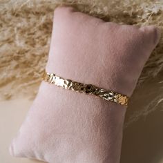 Introducing the beautiful Blake Gold Cuff! Expertly crafted from hammered gold, this stylish cuff will turn heads and add a signature touch of luxury to your look. Show off your individual style with this classic, timeless piece! BRACELET FEATURES 18k gold plated stainless steel Hypoallegenic and nickel free Adjustable fit 8mm thick Hammered design Elegant Hammered Cuff Bracelet, Luxury Gold Hammered Cuff Bracelet, Elegant Hammered Gold-plated Bracelets, Elegant Gold Hammered Cuff Bracelet, Luxury Gold Hammered Bangle, Elegant Gold Plated Hammered Bracelets, Elegant Formal Hammered Cuff Bracelet, Luxury Hammered Yellow Gold Cuff Bracelet, Luxury Hammered Bangle Cuff Bracelet