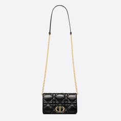 The Dior Caro Macrocannage bag showcases the House's couture spirit with a practical design. Crafted in calfskin, it stands out with a unique Macrocannage quilted effect. The flap has an antique gold-finish metal CD signature, and reveals compartments to hold all the essentials. The removable leather and CD-link chain strap can be wrapped around the flap, allowing the miniature bag to be carried by hand, over the shoulder or crossbody, thus making it the ideal daily bag.CD signature on the frontFlap closure2 compartments1 zipped pocket3 card slots1 rear curved patch pocketRemovable chain and leather shoulder strapMade in ItalyCOMPOSITIONCalfskinProduct code:S5135UNGX_M900SIZE GUIDE Width × Height × depth: 19.5 x 11 X 6.5 cm iphone that can store iPhone of all models Dior Caro, Daily Bag, Practical Design, Diaper Backpack, Casual Backpack, Dior Bag, Link Chain, Womens Backpack, Chain Strap