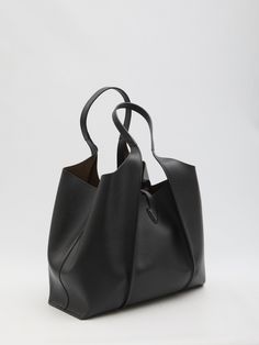 The T Timeless medium shopping bag in black grained leather is adorned with a T Timeless charm and boasts convenient features such as double handles, a snap-button tab closure, one spacious interior compartment, and a detachable zipped pouch. Its dimensions are 47x29x14cm. Dimensions: L 13.4 ins (extended compartment) x 9.8 ins x 5.5 ins Handles: height (drop) 10.2 ins Made in Italy Shopping Bag Leather Branded metal T Timeless pendant accessory Closure with strap and snap button Removable zipped pouch Product code: XBWTSBA0300Q8EB999 Composition: 100% leather Timeless Black Shoulder Bag For Shopping, Timeless Black Bags With Leather Handles, Timeless Rectangular Bags With Rolled Handles, Timeless Shopping Bag With Top Carry Handle, Timeless Shopping Shoulder Bag With Top Carry Handle, Timeless Soft Leather Shoulder Bag For Shopping, Timeless Bags With Removable Pouch For Shopping, Timeless Everyday Bags With Rolled Handles, Timeless Bag With Removable Pouch For Shopping