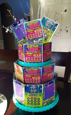 Lottery CakeBirthday gift/Raffle ideas Made from scratch off Lottery tickets and cardboard cupcake stand from party supply storeMore Birthday Party Centerpieces For Adults, Dads Birthday Surprise Ideas, Mom's 75th Birthday Gift Ideas, Corporate Event Prizes, Retirement Birthday Party, Birthday And Retirement Party Ideas, 80th Bday Gift Ideas, Lottery Ticket Gift Ideas 18th Birthday, Retirement/birthday Party Ideas