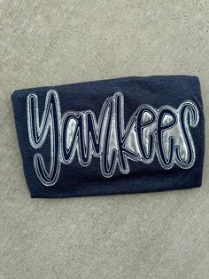 These Yankees shirts are super comfy as well as the perfect touch with jeans and to wear on gamedays!  Shirts are unisex and the shirt color can be changed! available in short sleeve, long sleeve and sweatshirts!  ❗️Sizes: Toddler-2T-5T  Youth XS-XL  Adult S-XL  Adult 2X- Adult 3X  The Heather navy blue shirt has a silver metallic and navy cursive Yankees double appliqué stitched onto the shirt. If you would like to request a custom order, please send us a message!! Sporty T-shirt With Embroidered Logo For Game Day, Casual Tops With Letter Embroidery For Sports Events, Baseball T, Applique Stitches, Navy Blue Shirts, Yankees Baseball, Baseball Shirts, Sweatshirts Women, Metallic Silver