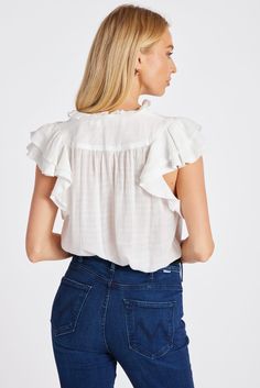 A wear-everyday hero, the Margarita Poplin Top features ruffled mandarin collar with split v-neck and double layer ruffle sleeves that adds soft romance to this versatile top. Throw it on over our Dolan D-Ring Pant or your favorite jeans, skirts, shorts—you name it. K4ETW2627E-NAT Ruffle Sleeve Tops For Layering, Chic Ruffled Tops For Daywear, Chic Ruffles Tops For Daywear, Feminine Flutter Sleeve Top With Ruffle Hem, Ruffle Sleeve Tops For Summer Layering, Brunch Tops With Ruffled Collar And Details, Brunch Tops With Ruffle Hem And Ruffled Collar, Feminine Daywear Tops With Flutter Sleeves, Chic Ruffle Sleeve Top For Daywear