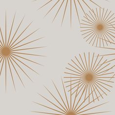 three golden sunbursts on a beige background