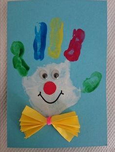 a paper plate with a hand and feet made to look like a clown