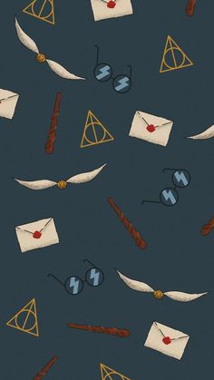 harry potter's wands, paper and glasses on a blue background with gold accents