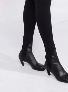 Black high-neck stirrup leggings from Wardrobe.NYC featuring stirrup cuffs, high waist and stretch-design. This item is in size L and the color is Chic Fitted Legwear For Work, Elegant Stretch Leggings For Evening, Chic Tight High-cut Leggings, Sleek Fitted High-cut Leggings, Elegant High-stretch High-cut Leggings, Fitted High-cut Leggings For Workwear, Elegant High Stretch Leggings With High-cut Leg, Elegant High Stretch Elastane Leggings, Chic High-cut Leg Elastane Leggings