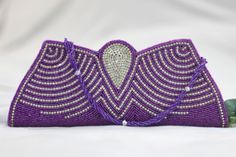 Message is directly if you're faany problems in ordering the product.  This piece has bead work on both front and back side. The sling attached to the wedding clutch is also beaded.  The purple bag has a magnetic closure. This purse is a style statement in itself. The body of the bag is ornamented with silver jewellery on the front. The purse is one of a kind. This is a true work of art. Wedding Pouch, Purse Wedding, Purple Clutch, Purple Bag, Wedding Clutch, Traditional Indian, Valentine Gift, Valentine Crafts, Style Statement