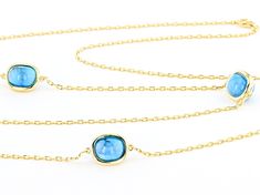 10x8mm Blue Freeform Turquoise 18k Yellow Gold Over Sterling Silver Station 36" Necklace. Measures Approximately 0.43"W. Lobster Claw Clasp. Fine Jewelry Turquoise Bezel Setting, Elegant Turquoise Jewelry With Bezel Setting, Formal Turquoise Jewelry With Polished Finish, Luxury Blue Briolette Jewelry, Turquoise Cabochon Necklace For Formal Occasions, Fine Turquoise Jewelry For Formal Occasions, Formal Turquoise Cabochon Necklace, Luxury Turquoise Oval Necklace, Formal Turquoise Birthstone Jewelry