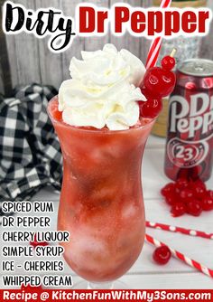 a red drink with whipped cream and cherries in it, next to a can of dr pepper