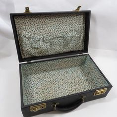 "We have a Travel Case Suitcase Vinyl Vintage item, collectible storage.  The outside is a black patterned vinyl with a leather carry handle and 2 metal locks (I do not have the keys - the rounds slide to the side to unlatch).  The inside of the case has been redone in a green & off-white fabric.  It measures about  15\" in w x about 5 1/4\" in h x about 9\" in d (these are the measurements as the case sits in the first photo).  There are some light signs of wear on the outside (the worst outlin Multi Pocket Bag, Vinyl Vintage, Cardboard Box Crafts, Doll Case, Vintage Suitcases, Trolley Bags, Vintage Picture Frames, Patterned Vinyl, Suitcase Traveling