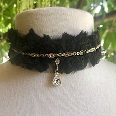 -This very special collection of one-of-a-kind chokers is called Black Dove x Wild Bride.-The designer sourced rare 1920s vintage components to recast and set with genuine Swarovski Crystals, for a timelessly elegant look.  -These beautiful crystal components were then attached to black lace trim with long ties, to make a truly unique choker.-The crystal color is called Crystal Silver Shade, which has an antique appearance.-Total length of the choker from end to end with ribbon ties is 40.5".  L Elegant Black Necklace For Celebration, Vintage Black Choker For Party, Elegant Adjustable Teardrop Choker, Antique Choker Necklace For Party, Elegant Black Necklace With Vintage Charm, Elegant Black Necklaces With Vintage Charm, Antique Black Necklace For Party, Victorian Choker Necklaces For Party, Victorian Style Black Jewelry For Party