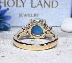 Don't miss this opportunity to own this beautiful gemstone ring crafted in 14k gold filled => Gemstone Type - Opal, Clear Quartz => Gemstone Cut - Cabochon, Faceted => Gemstone Size - 10 mm, 3 mm => Total Number of Gemstones - 3 => Metal Type - 14k Gold Filled (Tarnish Resistant And Nickel Free) - also available in 925 sterling silver * Please contact me for pricing on a sizes larger than 11 * ~ Feel free to ask me about custom made designs. ❏ Replacements and custom orders : ✪ 92 Gold Opal Ring With Prong Setting As Gift, Adjustable Yellow Gold Opal Ring For Anniversary, Gold Opal Round Cut Ring For Anniversary, Gold Opal Ring For Anniversary, Gold Opal Ring Stamped 14k, Gold Opal Promise Ring With Prong Setting, Opal Ring With Center Stone For Gift, Opal Ring With Center Stone As Gift, Gold Opal Ring For Anniversary With Round Cut