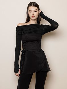 Editor's Notes The bustier top is made from tight spandex material for a tight fitting bodice and has a loosely draped top. - Triangle bottom hem- Thumbhole on sleeves- Tight fitting bodice and sleeves- Soft, flowy fabricMeasurements(in.)S / M- Length: 16.92 in. / 17.51 in.- Chest: 15.35 in. / 16.33 in.- Shoulder: 14.56 in. / 14.96 in.- Sleeve: 24.40 in. / 24.80 in.Model info: Sofia - Height 5' 8'', Fitting Size SComposition & Care- 75% Cotton, 21% Nylon, 4% Spandex- Dry clean Fitted Off-shoulder Top With Built-in Bra, Fitted Foldover Wrap Top, Fitted Wrap Top With Foldover Top, Stretch Crop Top With Built-in Bra For Evening, Draped Elastane Tops For Night Out, Elegant Fitted Wrap Top With Foldover Design, Black Draped Stretch Top, Fitted Elastane Tube Top For Evening, Black Stretch Draped Top