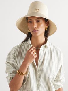 The elongated crown on Ruslan Baginskiy's bucket hat instantly sets it apart from other styles. Hand-woven from natural straw, it has a wide brim and the designer's initials decorating the front. Bucket Hat Outfit, Straw Bucket Hat, Safari Hat, Flat Dress Shoes, Gucci Eyewear, Dress Flats, The 1920s, Outfits With Hats, Ski Wear