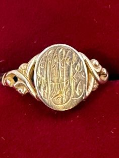 A 10K yellow gold vintage multi-initial signet ring for your consideration. This adorable ring is hallmarked 10K and guaranteed to be such.  It features an elaborately decorated signet with intricate calligraphic lettering on a decorative vintage art deco setting. The calligraphy is so decorative that it is hard to make out the letters so I've added pictures taken with the ring in two different directions. The top of the ring measures 9.7mm x 8.7mm.  It is a size 7 1/2 and weighs in at 1.60 gram Vintage Gold Engraved Ring With Maker's Mark, Antique Signet Ring With Maker's Mark For Formal Occasion, Antique Oval Hallmarked Signet Ring, Heirloom Signet Ring With Maker's Mark For Formal Occasions, Heirloom Style Formal Signet Ring With Maker's Mark, Gold Oval Signet Ring With Maker's Mark, Vintage Yellow Gold Signet Ring With Maker's Mark, Yellow Gold Antique Signet Ring With Maker's Mark, Antique Yellow Gold Signet Ring With Maker's Mark