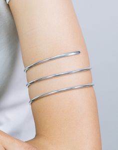 "Minimalist Upper Arm Band, Open Cuff Bracelet, Cuff Bracelet for Women, Bridesmaids Gift, Upper Arm Jewelry Features- * Made to order * Materials: Brass, Aluminum, and Copper * Length: 9\" inches * Layaway Plan Available - SKU: CUFF004 For Ready-to-ship items search here, https://etsy.me/39BDvMS Price is for one piece of bangle All silver, gold or platinum pieces are stamped with the metal type on the inside. Feel free to contact me with any questions or requests. IMPORTANT NOTE: UK, France, an Adjustable Minimalist Bangle Bracelet, Adjustable Minimalist Metal Cuff Bracelet, Silver Minimalist Flexible Jewelry, Minimalist Adjustable Cuff Bracelet, Adjustable Metal Bangle In Minimalist Style, Minimalist Silver Flexible Bracelet, Minimalist Flexible Silver Bracelet, Adjustable Minimalist Metal Bangle, Minimalist Flexible Cuff Bracelet As Gift