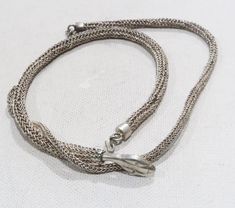 This is a really pretty mesh sterling snake necklace. The snake face is etched,. The necklace is 15 inches. So it will be more like a choker. Unmarked. Very reminiscent of Whiting and Davis. The face is about an inch wide. The center is 0.45 inches wide and the other part of the necklace is 0.2 inches wide. Has a hook closure. Weighs 23 grams. Snake Face, Snake Choker Necklace, Snake Choker, Snake Necklace, The Snake, Choker Necklaces, The Face, Choker Necklace, Daisy