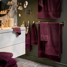 a bathroom with towels hanging on the wall